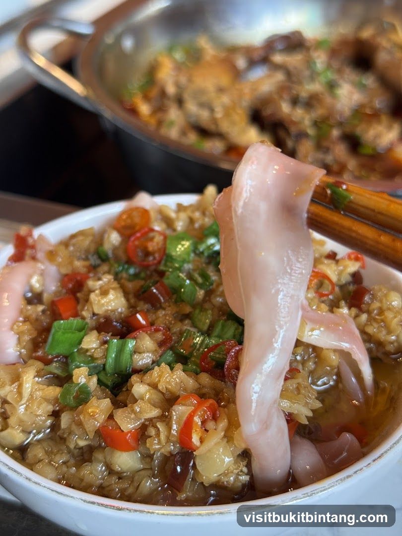 Close-up of a dish with meat and chili peppers