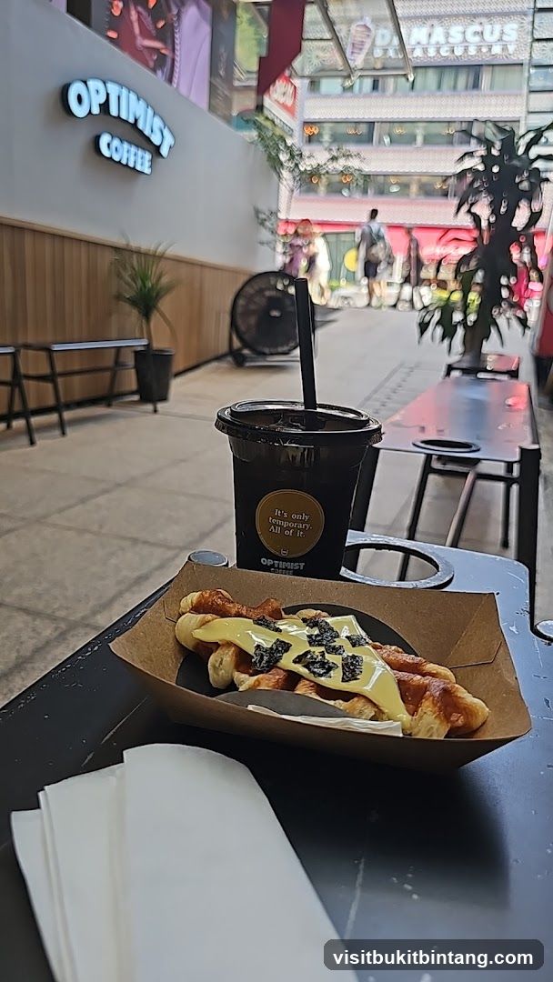 Optimist Coffee Croissant and Drink