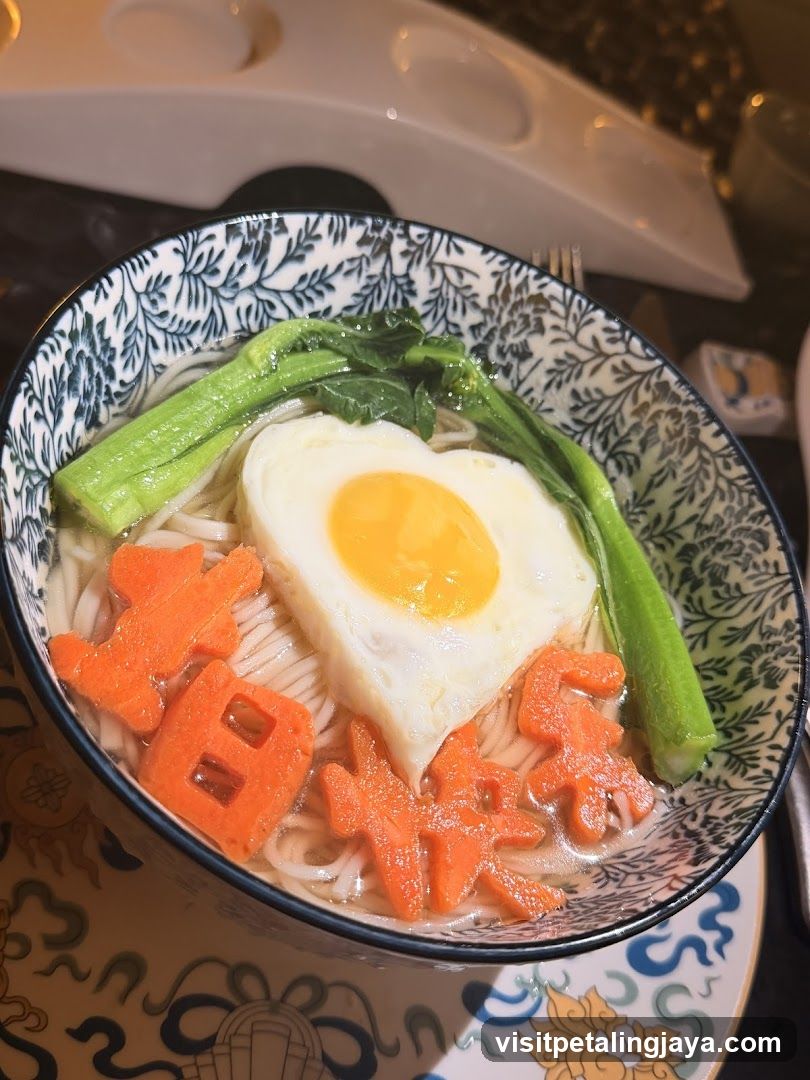 Bowl of noodles with egg and vegetables