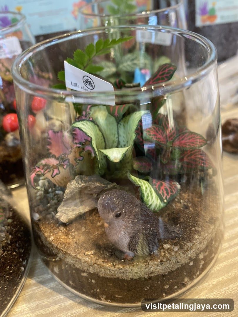 Glass Terrarium with Miniature Bird Figurine