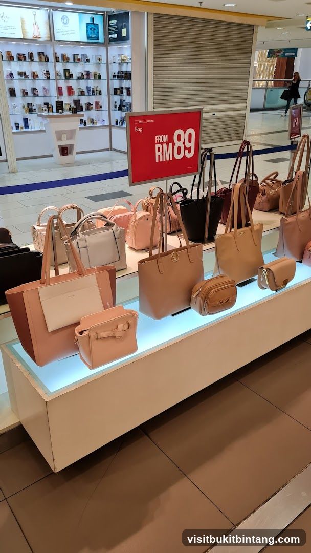 Handbag display with sale sign