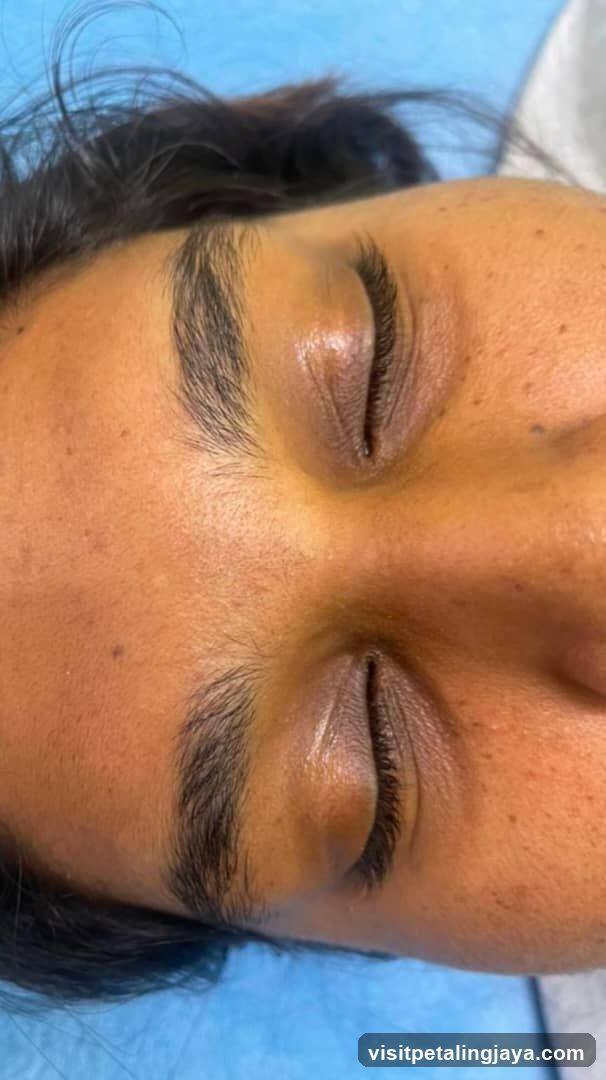 Close-up of a person's face with closed eyes
