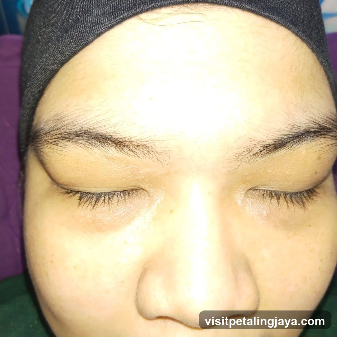 Face with closed eyes and headband