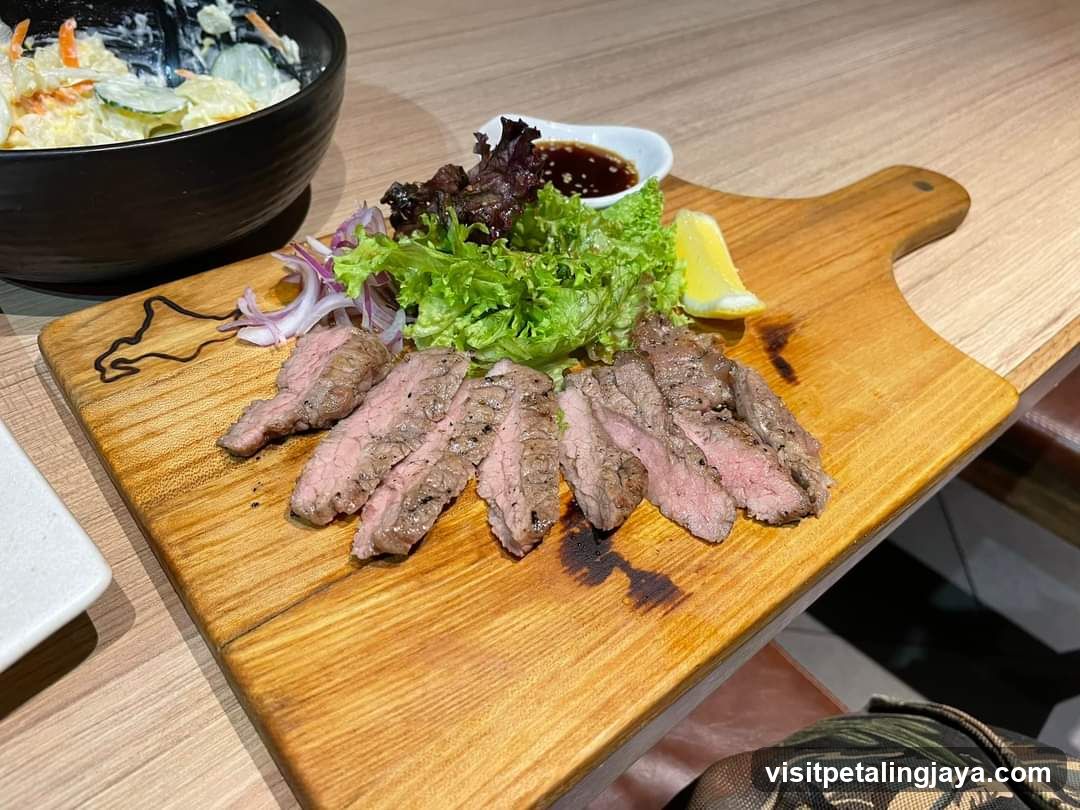 Sliced Steak Platter with Salad and Sauce