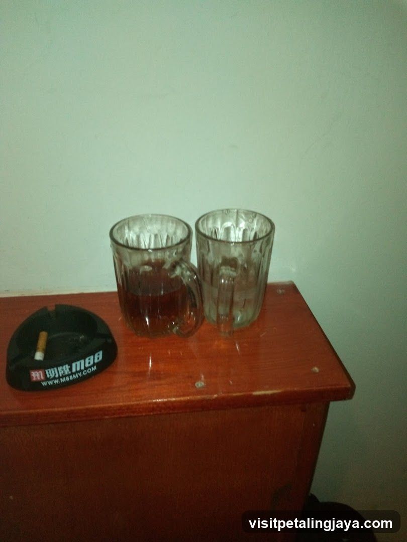 Cup and Ashtray on Wooden Surface