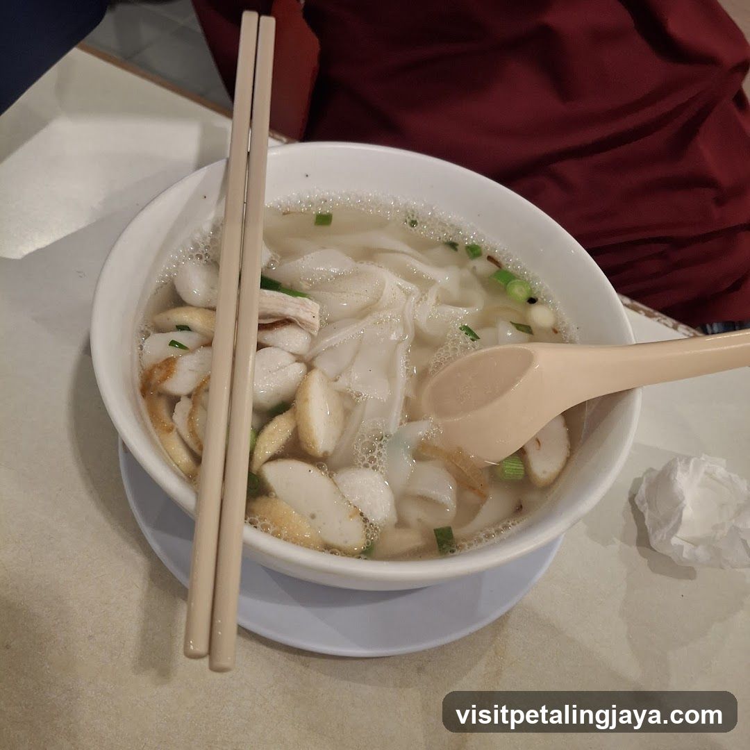 Bowl of Soup with Noodles and Fish Balls