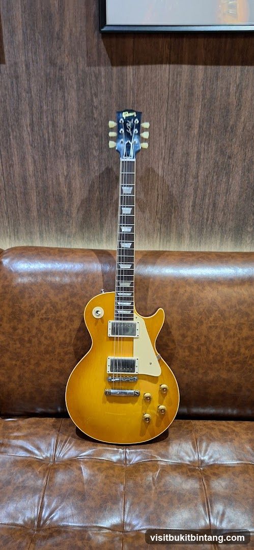 Electric Guitar on Leather Couch
