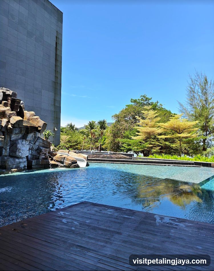 Poolside View with Rockwork and Building Facade