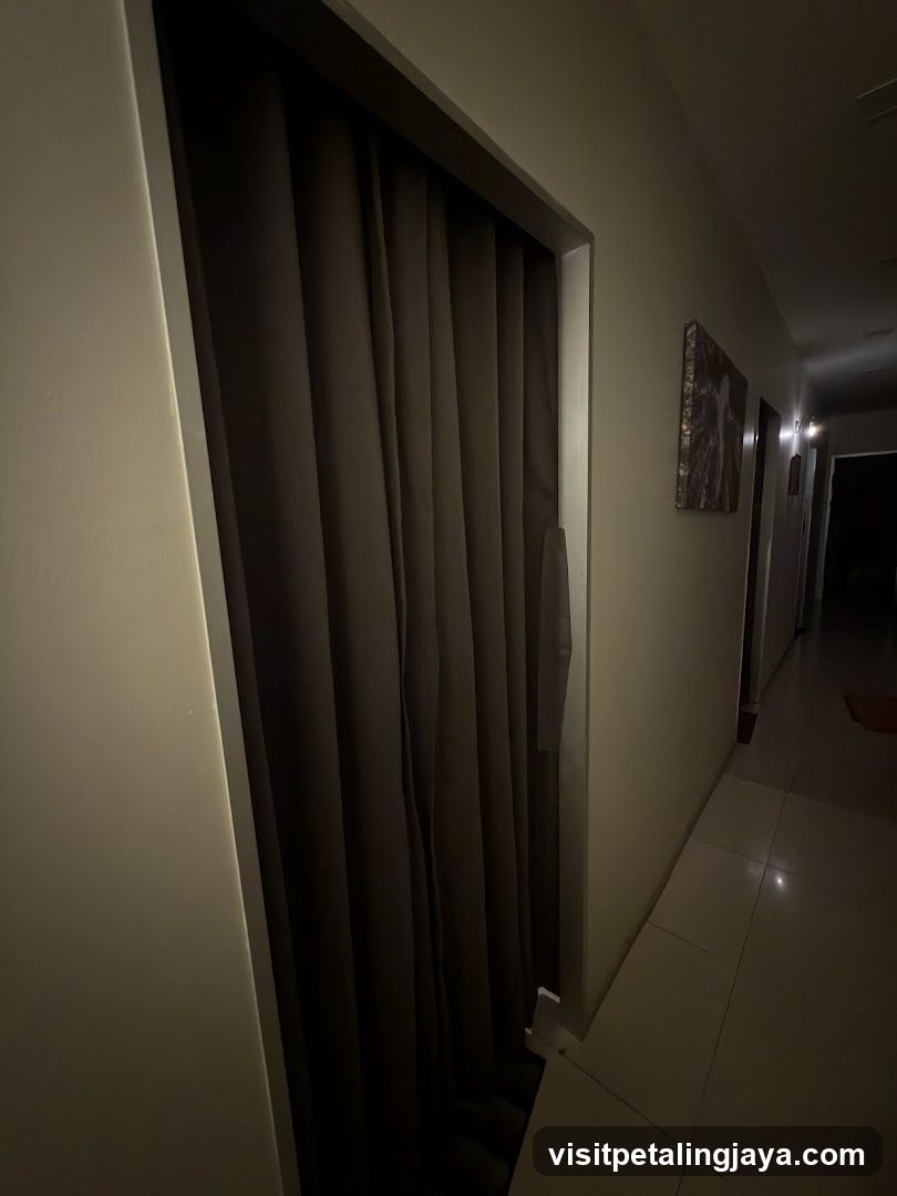Dimly lit hallway with closed door