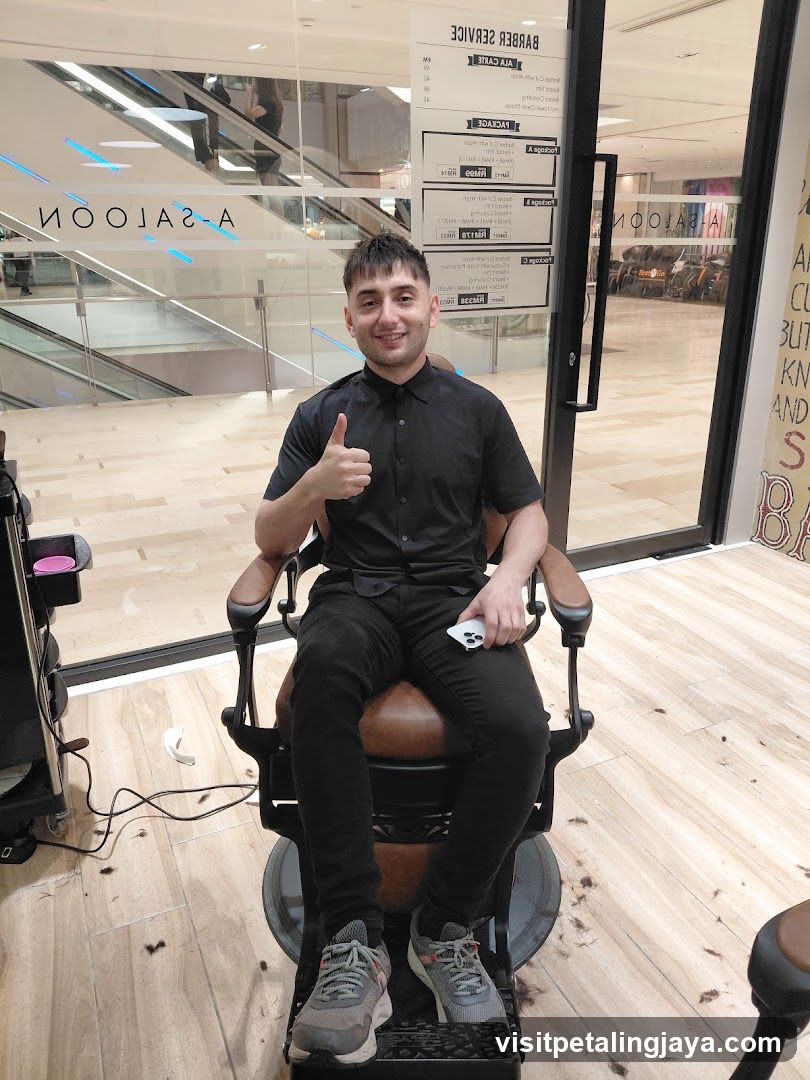 Barber Shop Interior with Staff Member