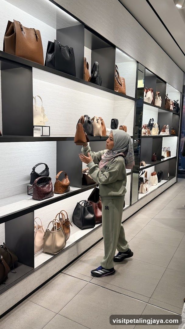 Woman Browsing Handbags in Store