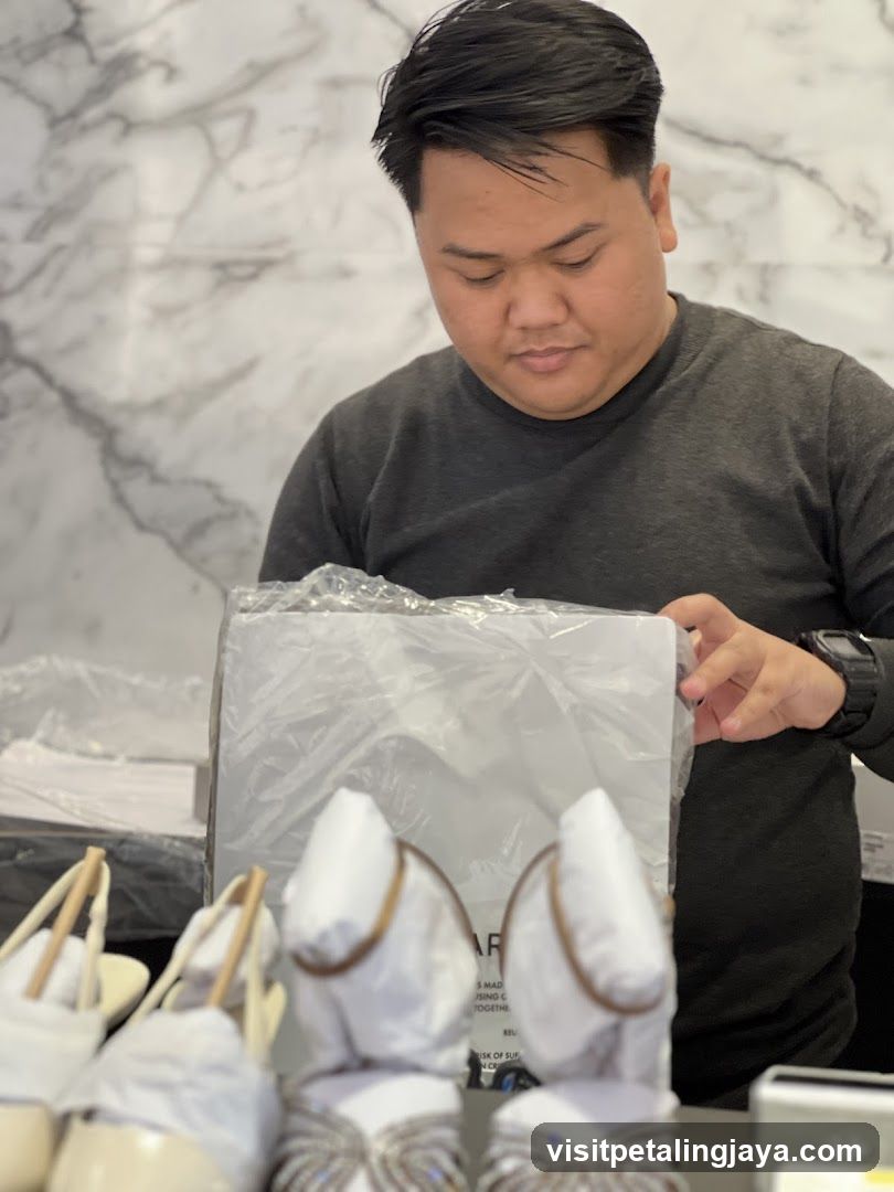 Man Inspecting Shoes in Store