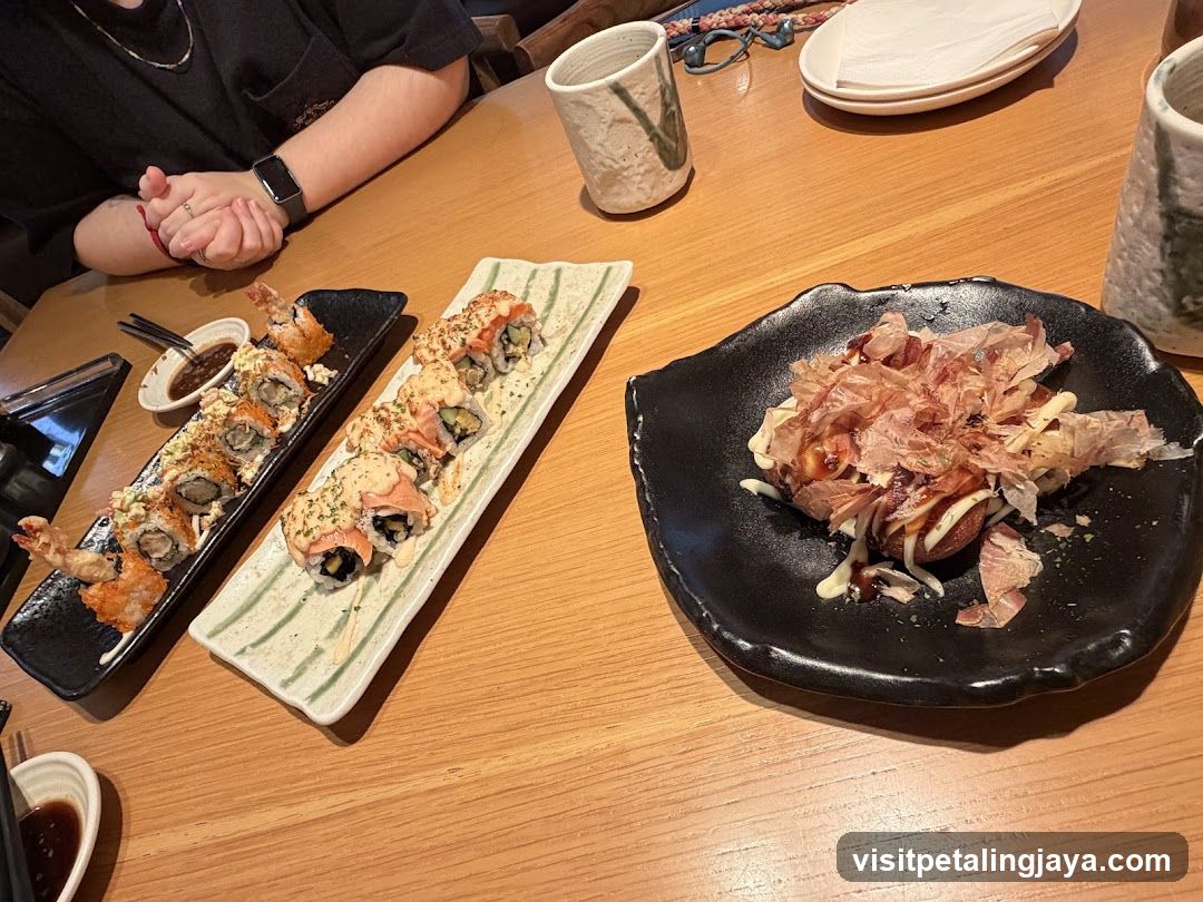 Sushi and Okonomiyaki at a Restaurant Table