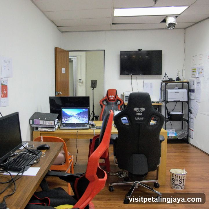 Office Interior with Gaming Chairs and Tech Setup