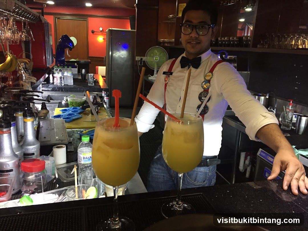 Bartender with drinks