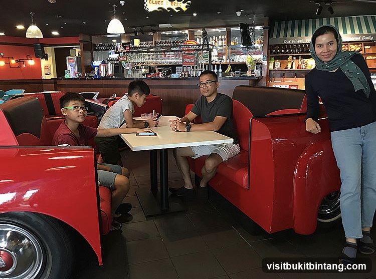 Family dining in a retro-themed restaurant