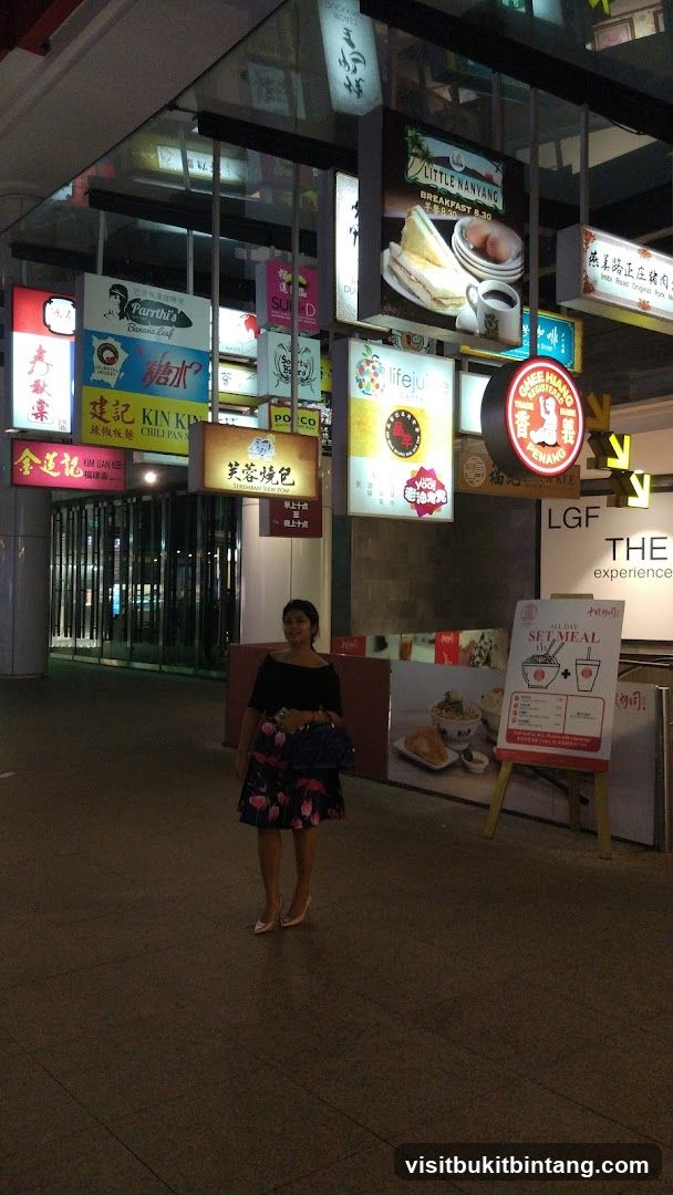 Street Scene with Signs and Woman