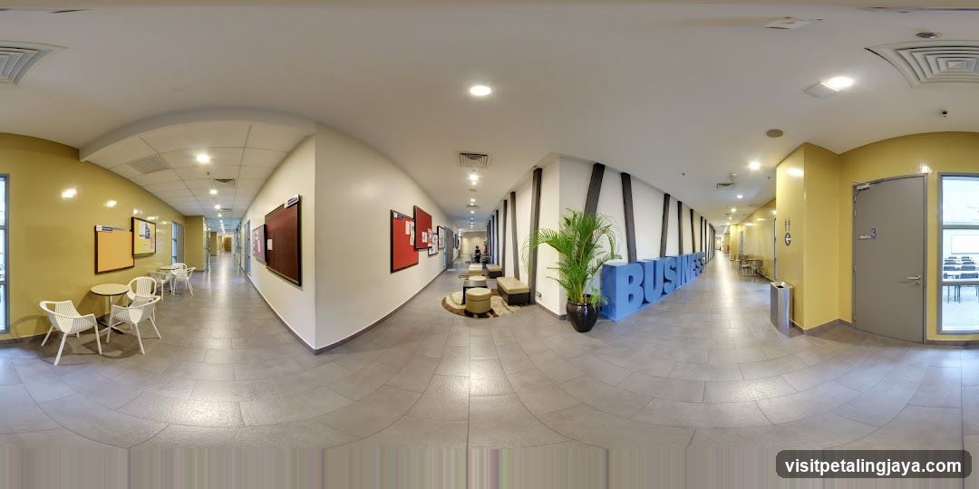 Interior Hallway with Bulletin Boards and Seating Area