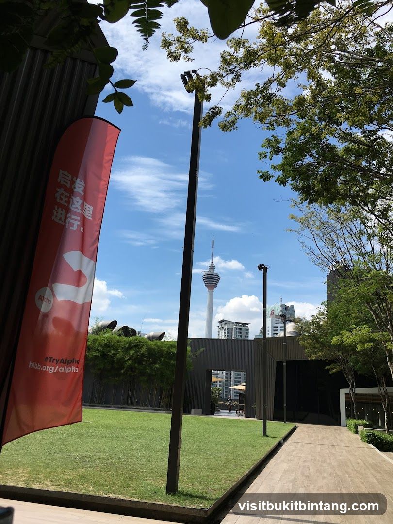 Outdoor area with a flag and tower in the background