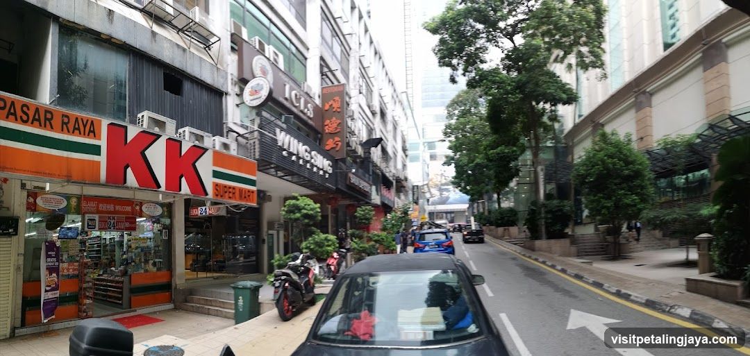 Street View with KK Super Mart and Wing Sing Restaurant