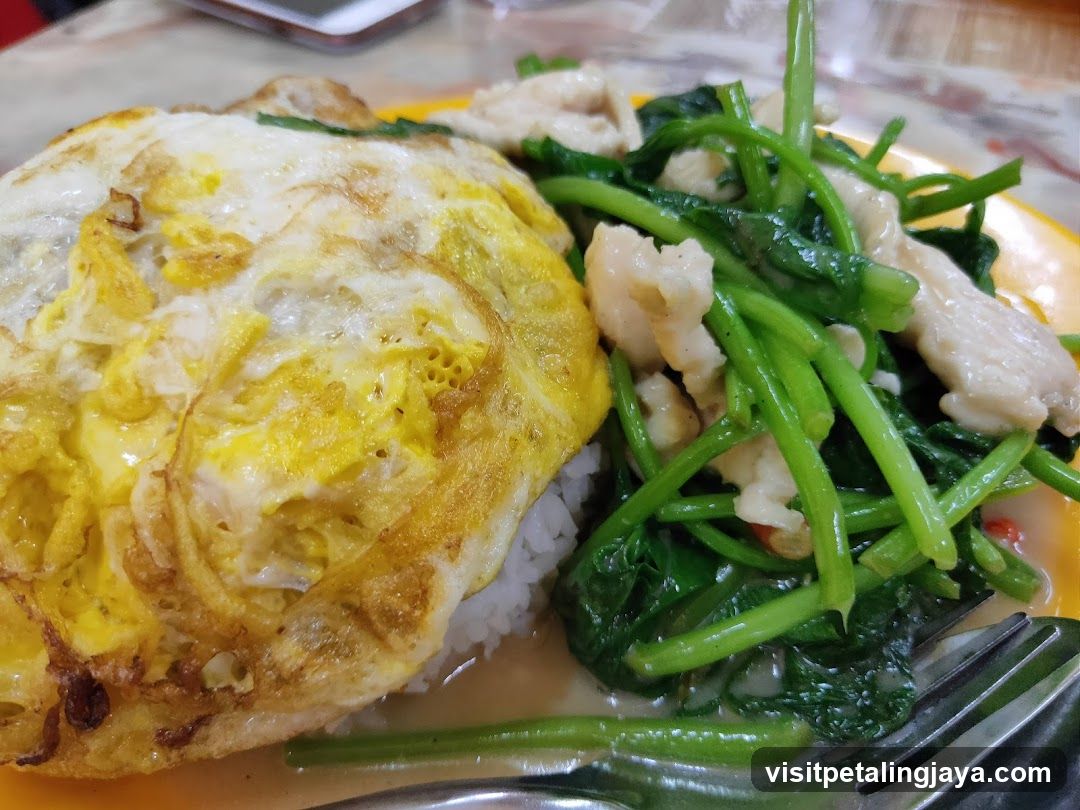 Plate of Fried Rice with Egg and Stir-fried Greens