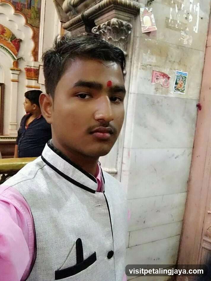 Young man in temple interior