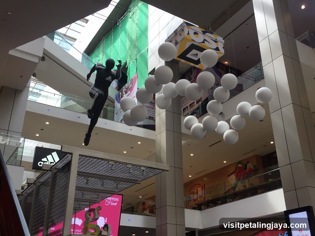 Shopping Mall Interior with Hanging Decorations