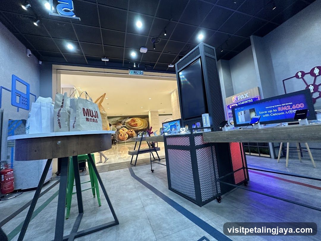 Interior of a retail space with Muji bags and electronics display
