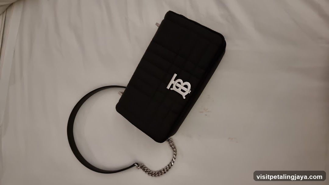 Black quilted handbag with logo