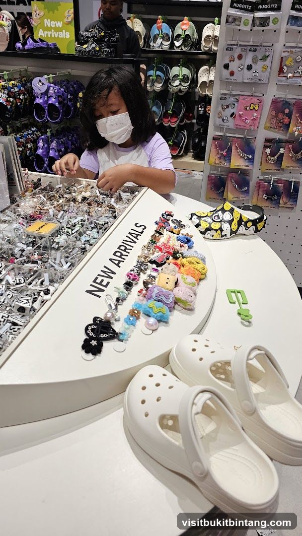 Girl Browsing Charms in a Shoe Store