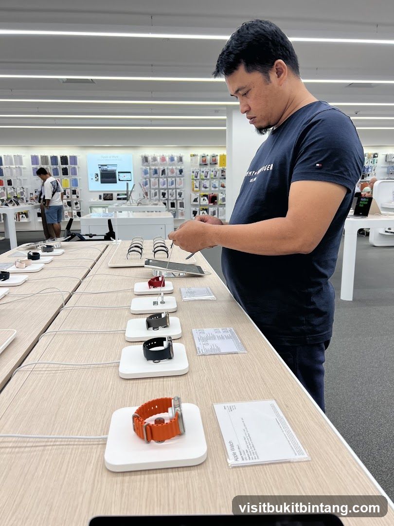 Man examining smartwatches in a store