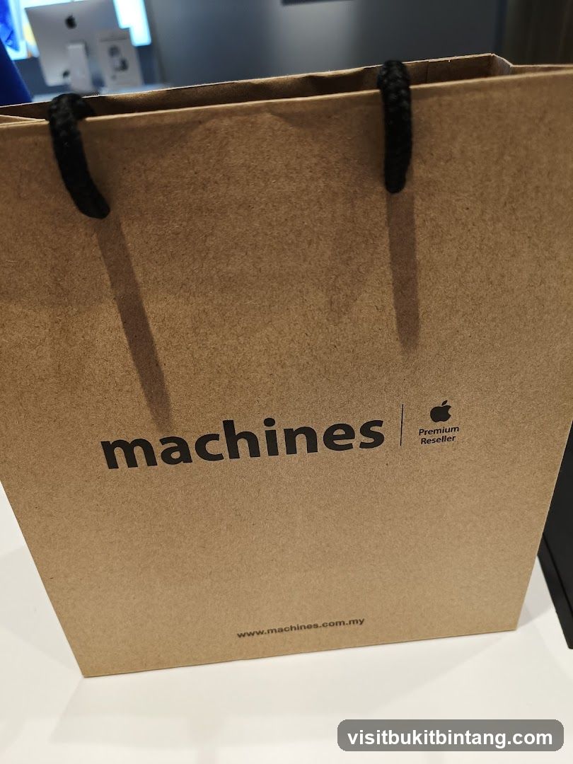 Brown paper shopping bag with "machines" logo