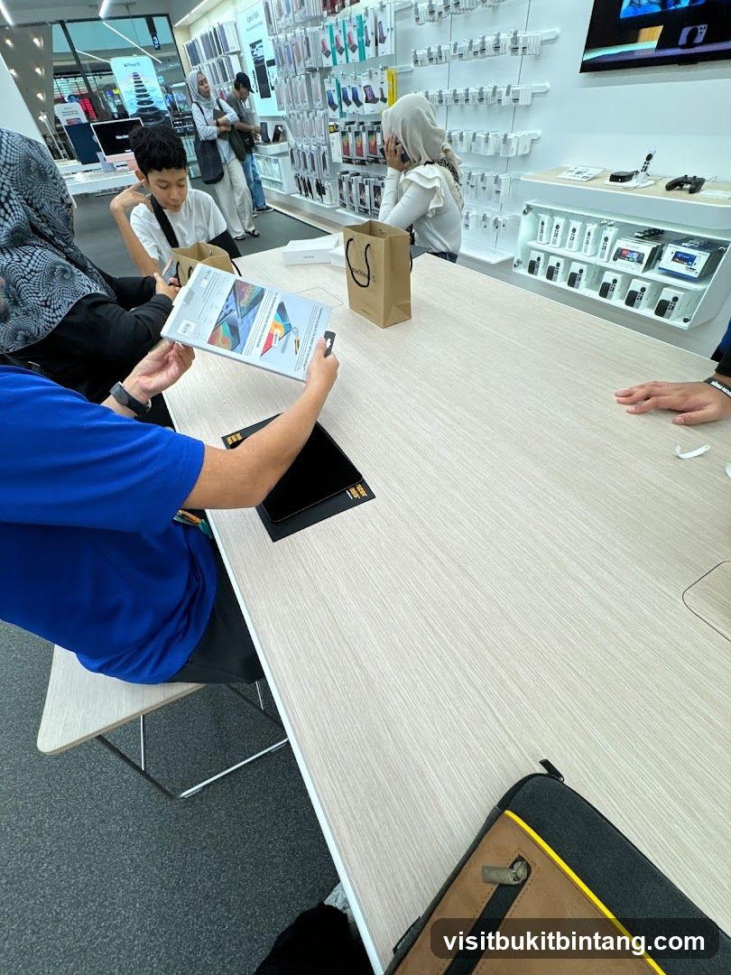 Customers browsing electronics in a store
