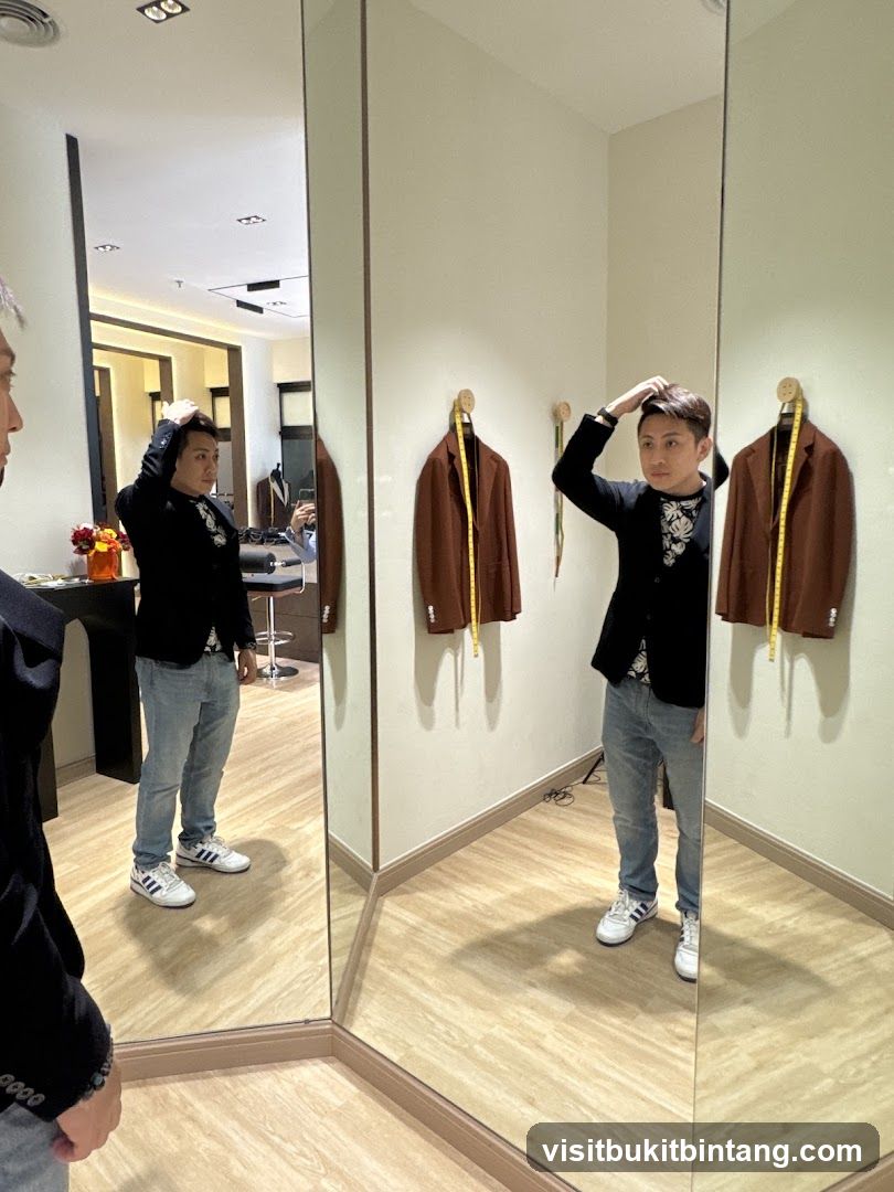 Man trying on a jacket in a fitting room