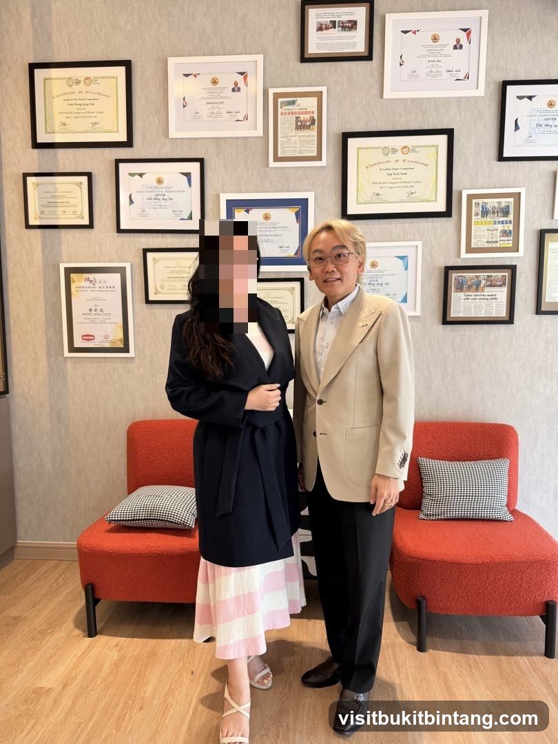 Two people standing in front of framed certificates