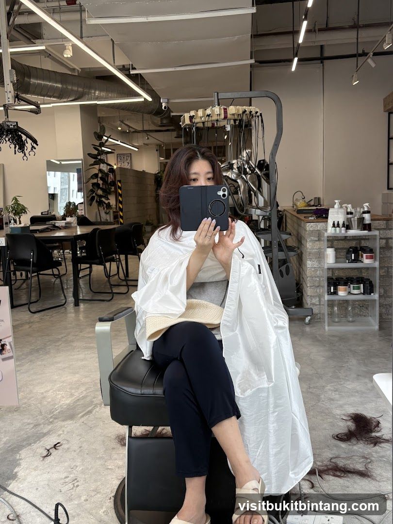 Woman taking a selfie in a salon
