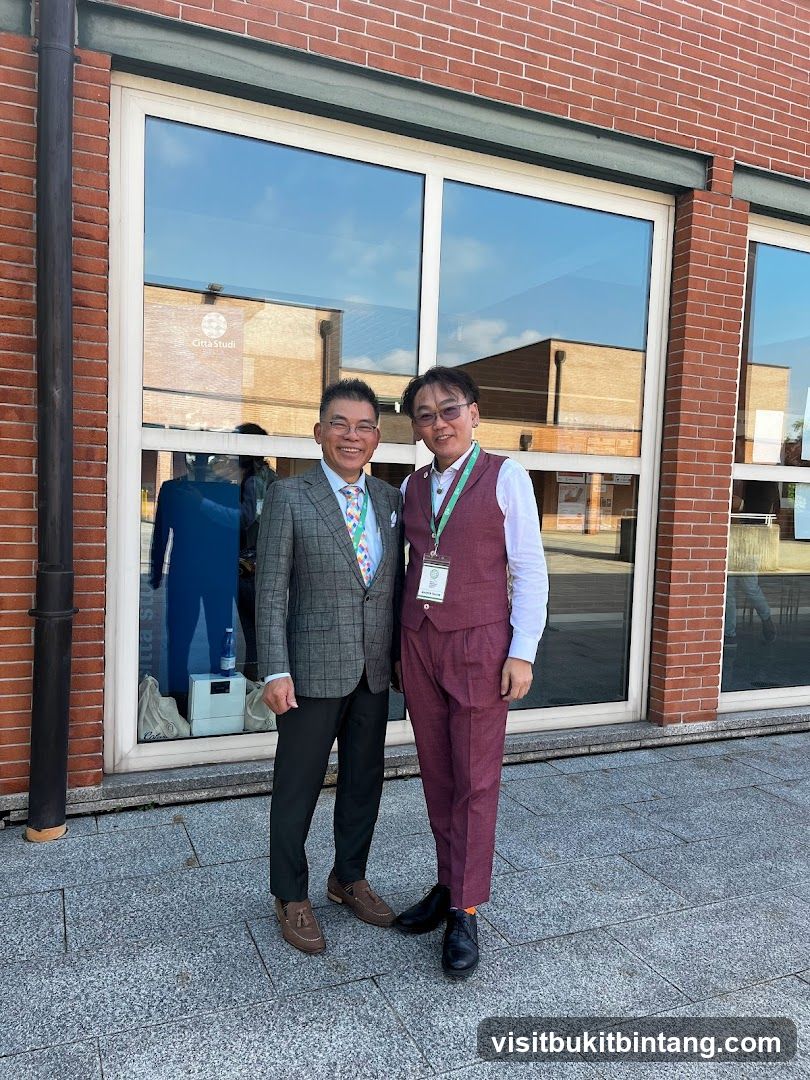 Two men in suits standing in front of a building