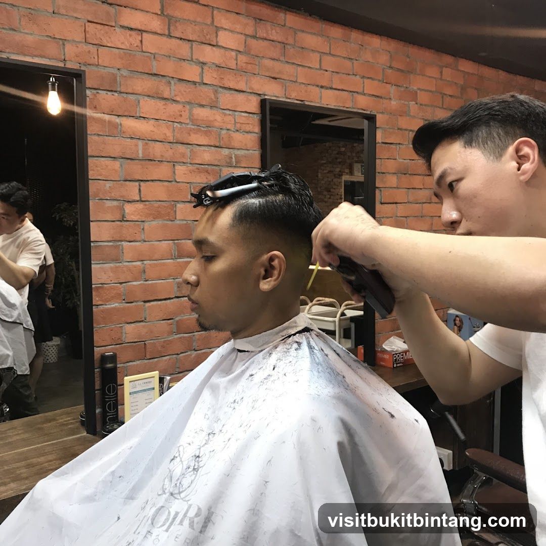 Barber cutting client's hair