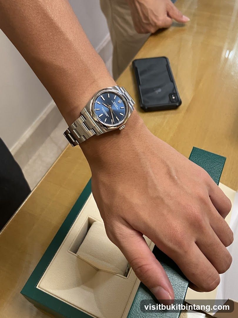 Person wearing a Rolex watch