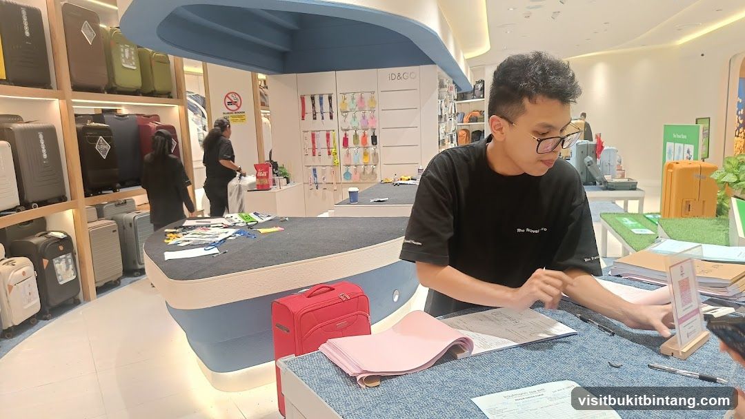 Store interior with luggage and staff