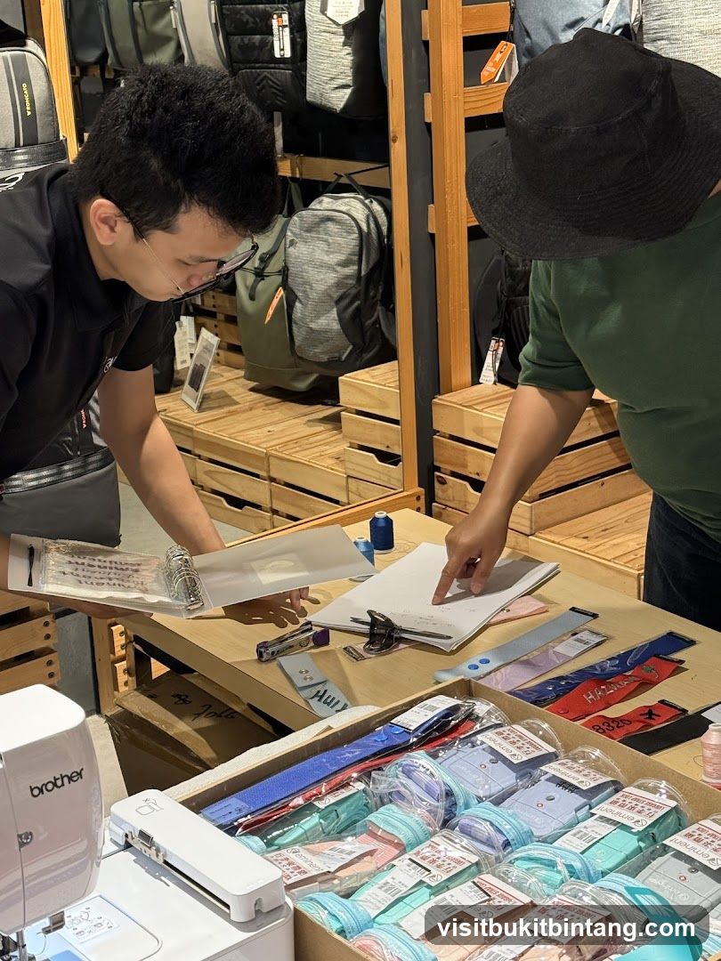 Two people examining items on a table
