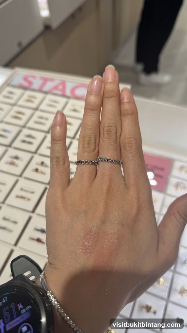 Woman's hand with rings in jewelry store