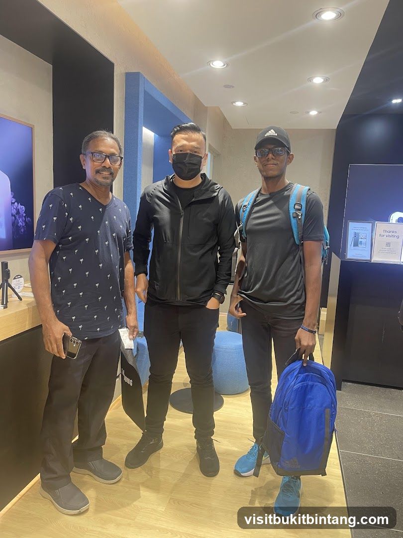 Three men posing for a photo inside a store
