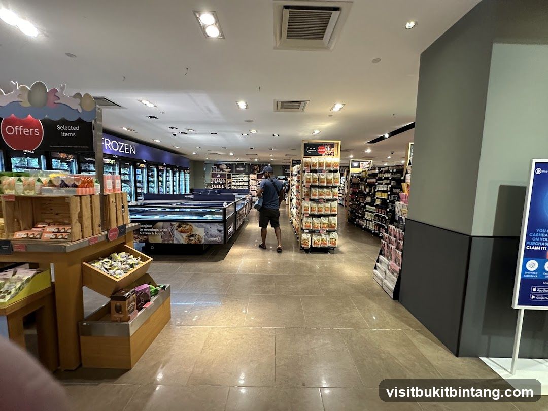 Supermarket aisle with frozen food and shelves of products