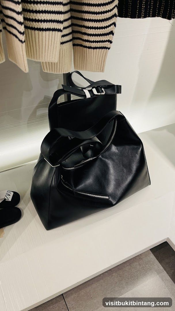 Black Leather Handbags and Striped Sweaters