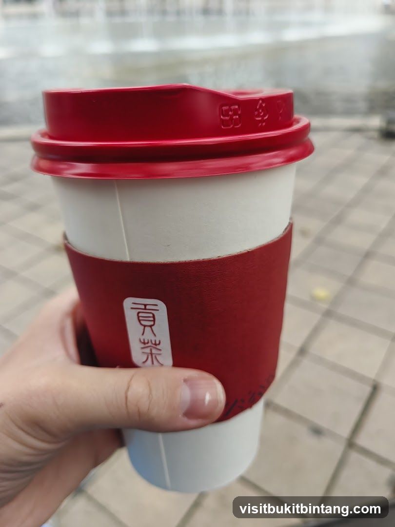 Cup with red sleeve