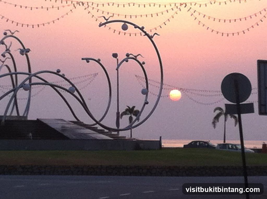 Sunset over a coastal area with decorative structures