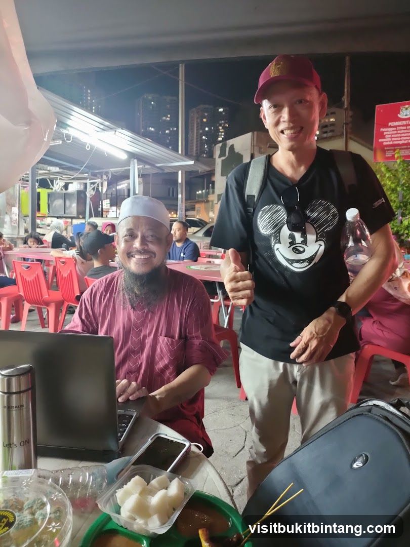 Two men at an outdoor food stall