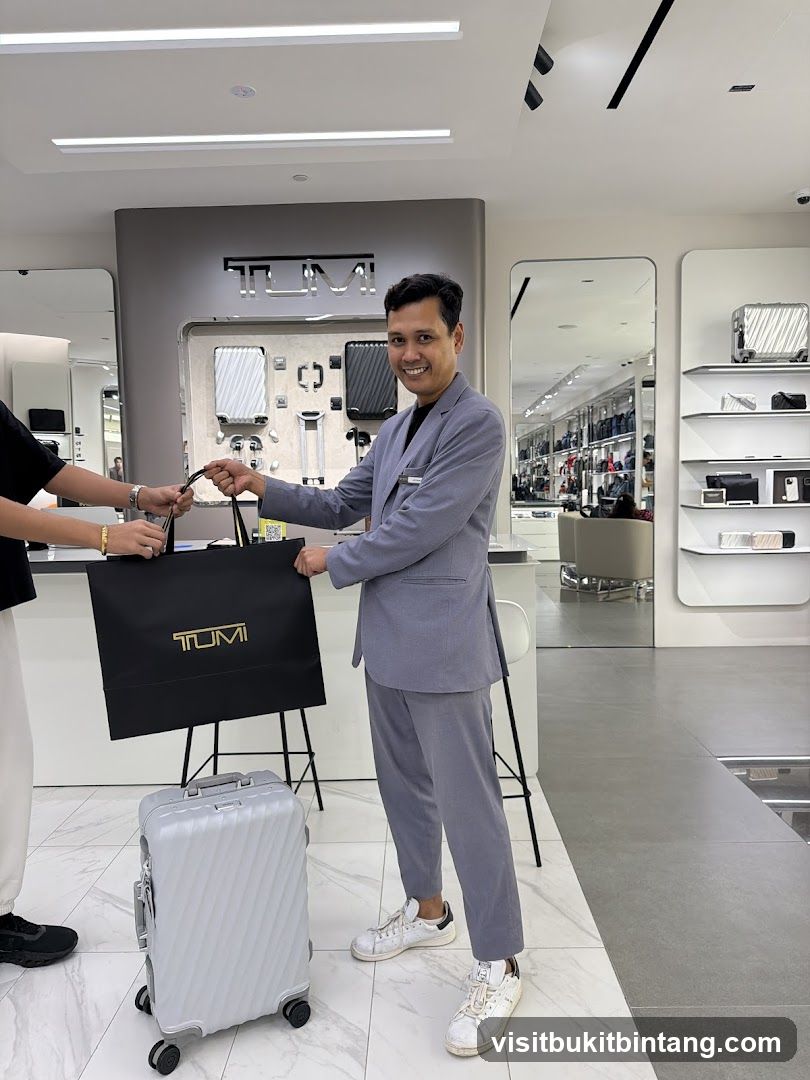Sales Associate Handing Over a TUMI Shopping Bag