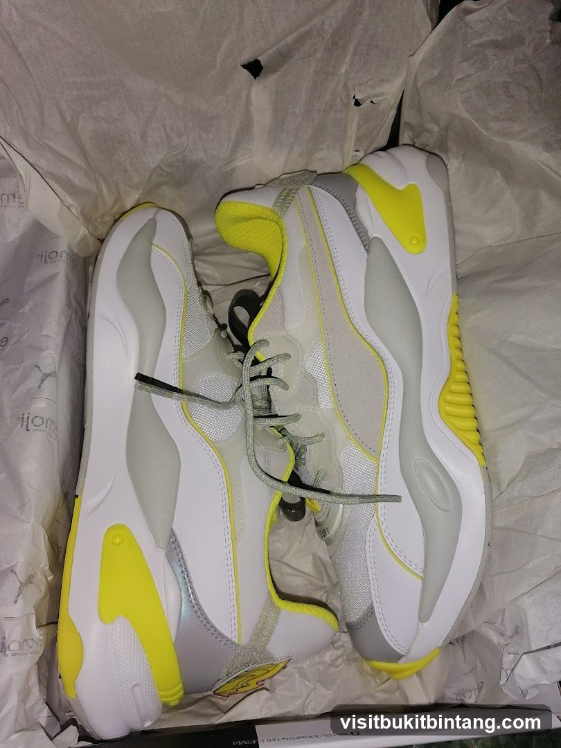 White and Yellow Sneakers in a Box